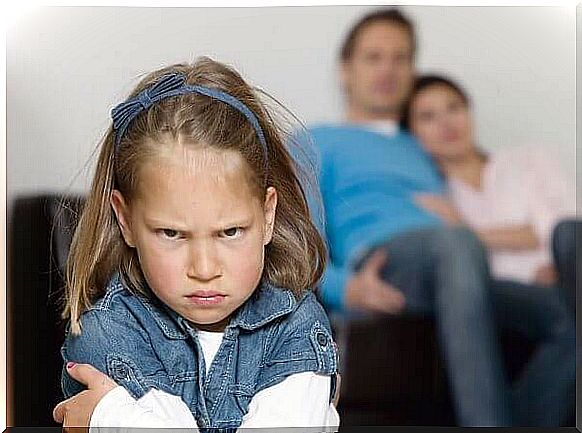 Little girl angry at her parents because of their behavior problems.