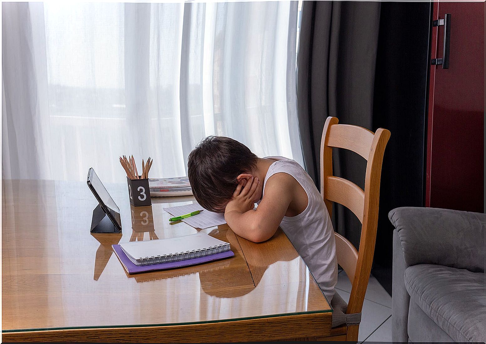 Child getting tired because he does not want to do homework.