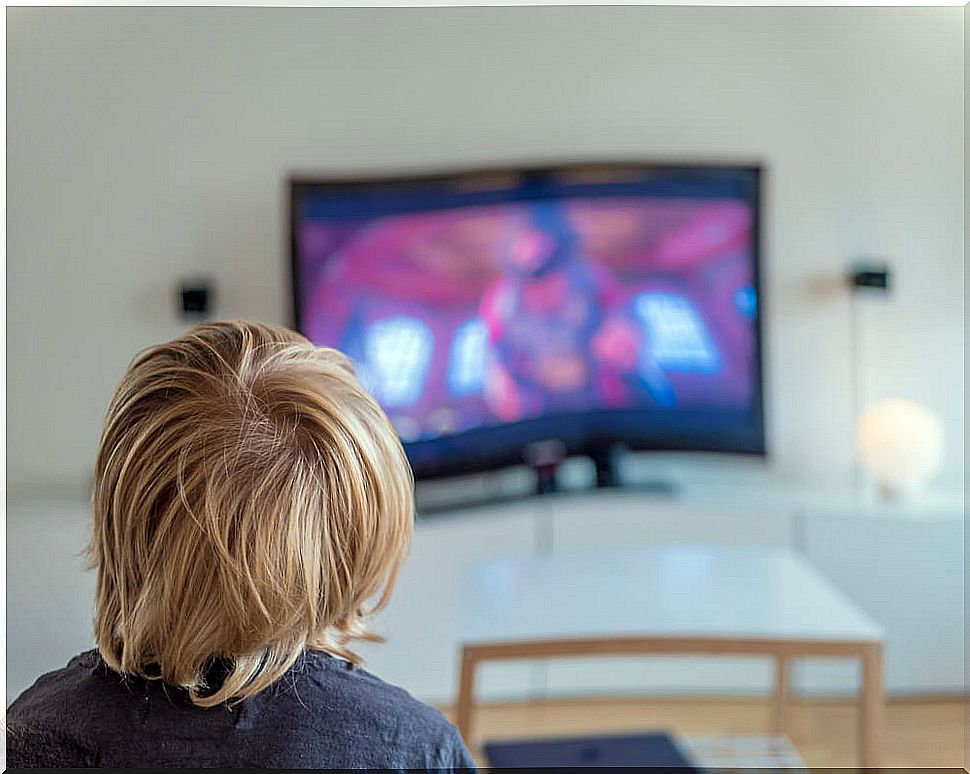 Child watching a movie on television.